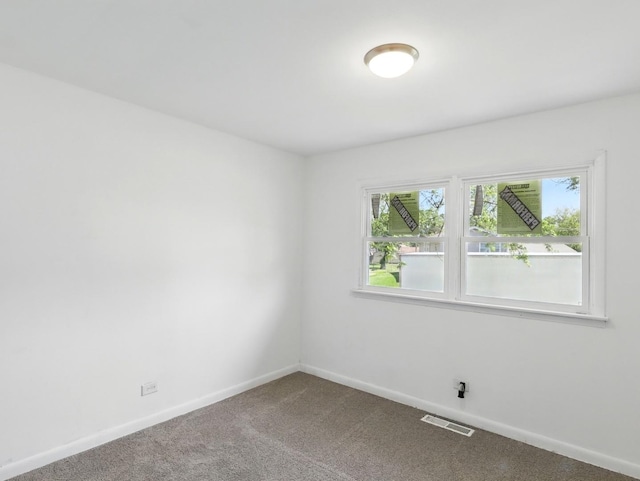 17704 Grandview Dr, Hazel Crest, IL 60429 - carpeted empty room featuring plenty of natural light and baseboards