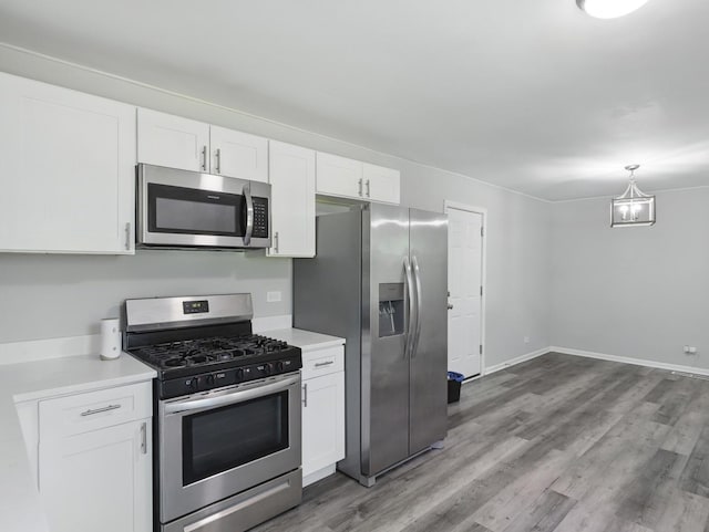 17704 Grandview Dr, Hazel Crest, IL 60429 - kitchen featuring stainless steel appliances, white cabinets, light countertops, and wood finished floors