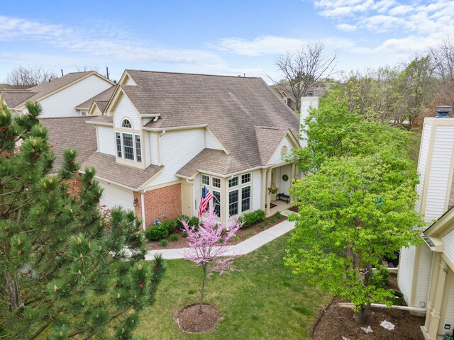 538 Pembrook Ct S, Crystal Lake, IL 60014 - back of property featuring roof with shingles, a yard, a chimney, and brick siding