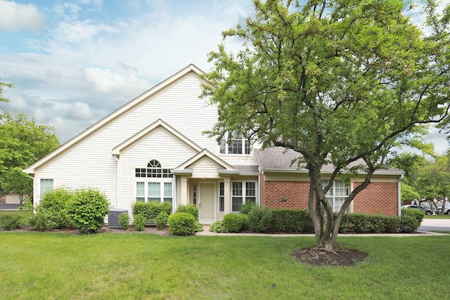 339 Ashford Cir Unit 1, Bartlett, IL 60103 - traditional-style home featuring a front lawn, brick siding, and central AC