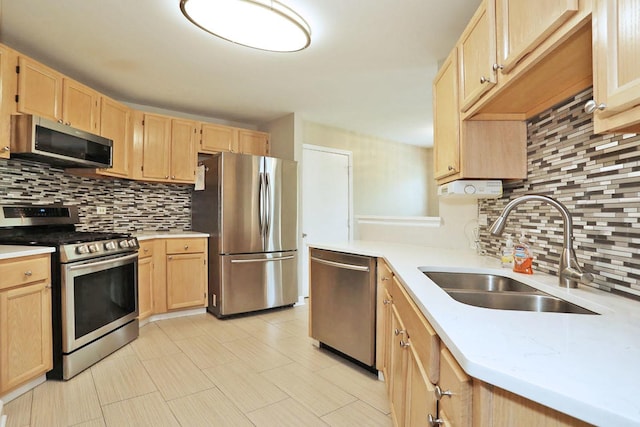 339 Ashford Cir Unit 1, Bartlett, IL 60103 - kitchen with stainless steel appliances, light brown cabinets, a sink, and decorative backsplash