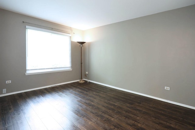 339 Ashford Cir Unit 1, Bartlett, IL 60103 - empty room with dark wood-style flooring and baseboards