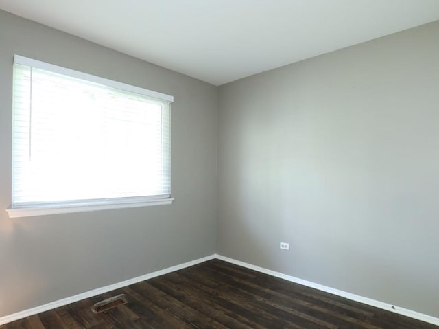339 Ashford Cir Unit 1, Bartlett, IL 60103 - empty room featuring baseboards and dark wood-style floors