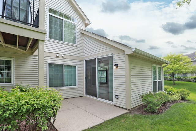 339 Ashford Cir Unit 1, Bartlett, IL 60103 - view of exterior entry with a patio area and a yard