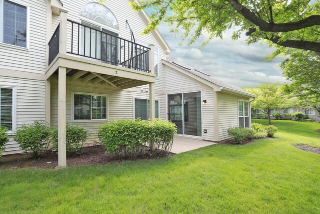 339 Ashford Cir Unit 1, Bartlett, IL 60103 - back of house featuring a balcony, a yard, and a patio area