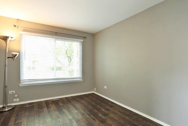 339 Ashford Cir Unit 1, Bartlett, IL 60103 - unfurnished room with dark wood-type flooring and baseboards