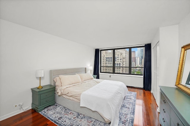 222 E Pearson St Unit 1504, Chicago, IL 60611 - bedroom featuring dark wood-type flooring and baseboards