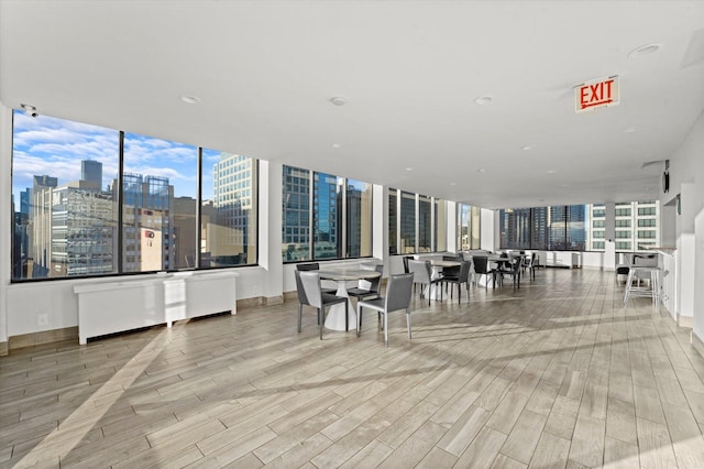 222 E Pearson St Unit 1504, Chicago, IL 60611 - dining room with wood finished floors and a city view