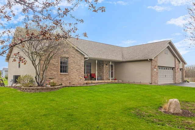 5775 S Indian Trl, Rochelle, IL 61068 - single story home with brick siding, a front lawn, an attached garage, driveway, and a porch