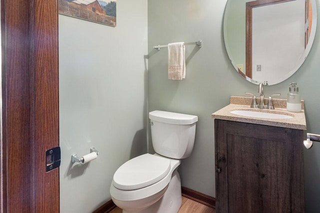 5775 S Indian Trl, Rochelle, IL 61068 - half bath with toilet, vanity, wood finished floors, and baseboards