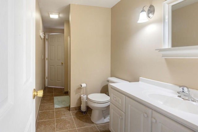 5775 S Indian Trl, Rochelle, IL 61068 - bathroom featuring vanity, toilet, tile patterned floors, and baseboards