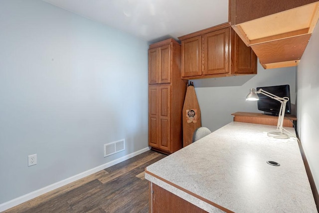5775 S Indian Trl, Rochelle, IL 61068 - kitchen with dark wood-style floors, brown cabinets, baseboards, and light countertops