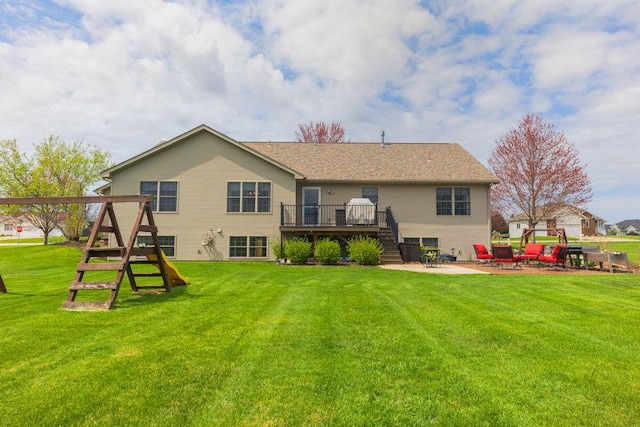 5775 S Indian Trl, Rochelle, IL 61068 - back of house featuring stairway, a deck, a patio area, and a yard