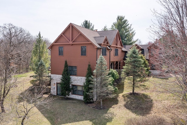 10A52 Cardinal Ct, Apple River, IL 61001 - view of side of home featuring stone siding, a yard, and board and batten siding