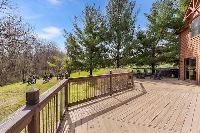 10A52 Cardinal Ct, Apple River, IL 61001 - wooden deck featuring a fire pit, outdoor dining area, and a lawn
