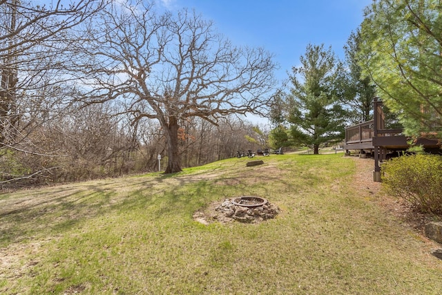 10A52 Cardinal Ct, Apple River, IL 61001 - view of green lawn with an outdoor fire pit and a wooden deck