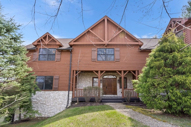 10A52 Cardinal Ct, Apple River, IL 61001 - view of front of house with stone siding, covered porch, a front lawn, and a shingled roof