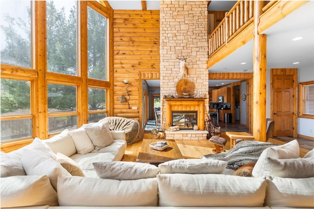 10A52 Cardinal Ct, Apple River, IL 61001 - living area featuring a high ceiling, wood finished floors, a fireplace, recessed lighting, and wooden walls