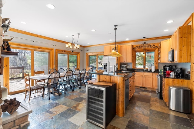 10A52 Cardinal Ct, Apple River, IL 61001 - kitchen with stainless steel appliances, beverage cooler, stone tile floors, recessed lighting, and dark countertops