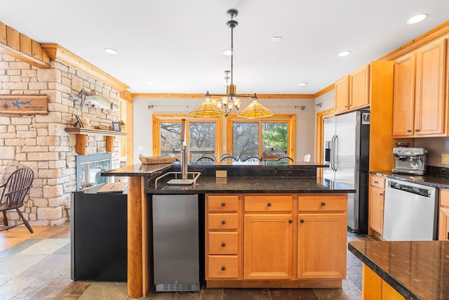 10A52 Cardinal Ct, Apple River, IL 61001 - kitchen with stainless steel appliances, a kitchen island with sink, recessed lighting, stone tile flooring, and hanging light fixtures