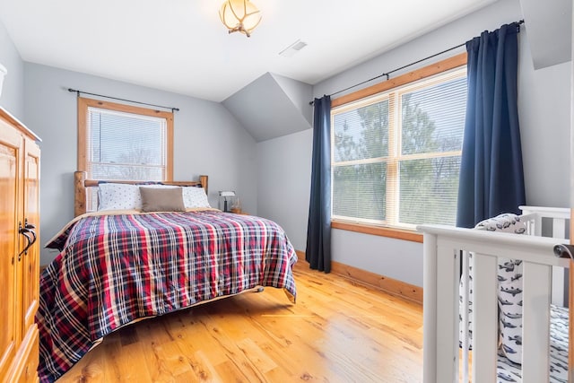 10A52 Cardinal Ct, Apple River, IL 61001 - bedroom featuring multiple windows, wood finished floors, and baseboards