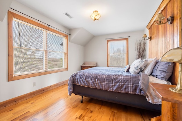 10A52 Cardinal Ct, Apple River, IL 61001 - bedroom featuring wood finished floors, baseboards, and vaulted ceiling