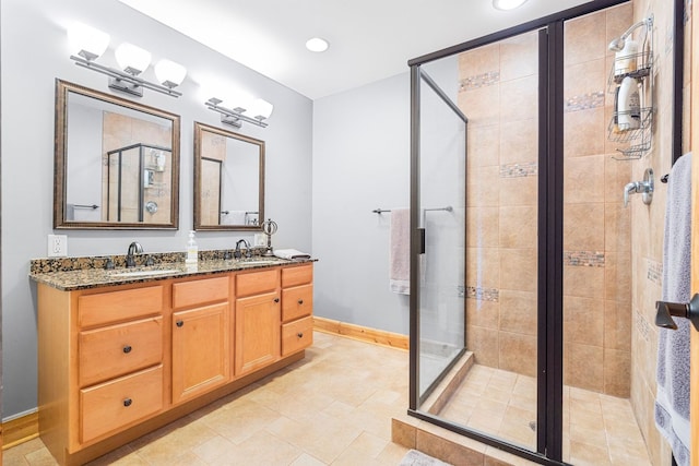 10A52 Cardinal Ct, Apple River, IL 61001 - bathroom featuring a shower stall, double vanity, recessed lighting, and baseboards