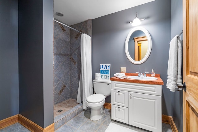 10A52 Cardinal Ct, Apple River, IL 61001 - bathroom with vanity, toilet, a tile shower, and baseboards