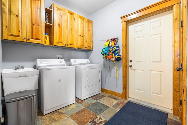 10A52 Cardinal Ct, Apple River, IL 61001 - laundry room with cabinet space, stone tile flooring, washing machine and clothes dryer, and baseboards
