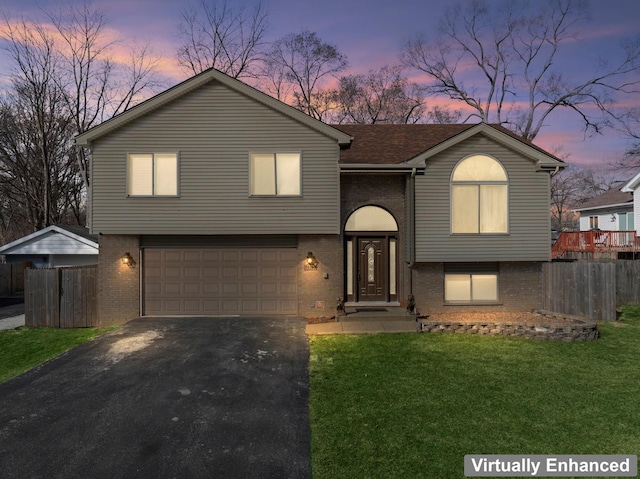 17408 Fisk Ave, East Hazel Crest, IL 60429 - view of front facade featuring brick siding, asphalt driveway, and an attached garage