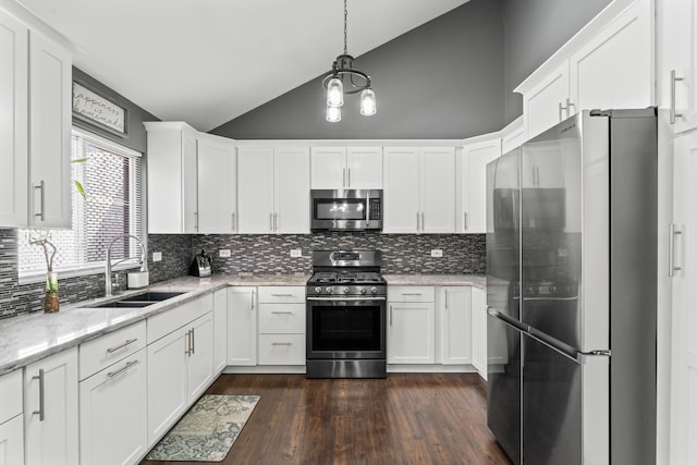 17408 Fisk Ave, East Hazel Crest, IL 60429 - kitchen featuring appliances with stainless steel finishes, a sink, lofted ceiling, dark wood-type flooring, and white cabinetry