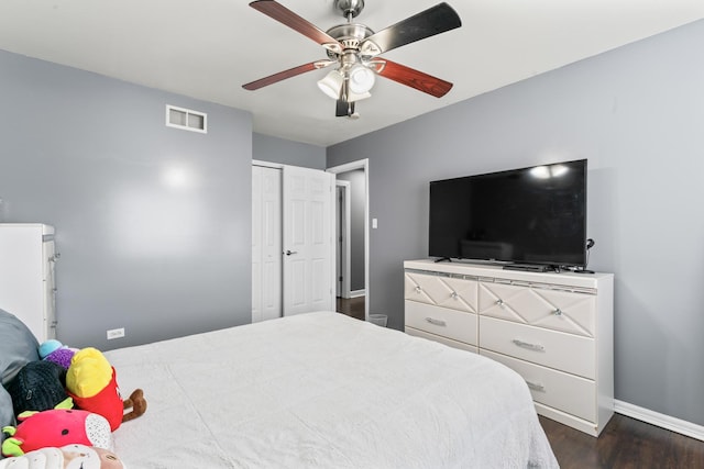 17408 Fisk Ave, East Hazel Crest, IL 60429 - bedroom with dark wood finished floors, baseboards, ceiling fan, and a closet