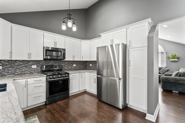 17408 Fisk Ave, East Hazel Crest, IL 60429 - kitchen featuring stainless steel appliances, backsplash, high vaulted ceiling, light stone counters, and white cabinets