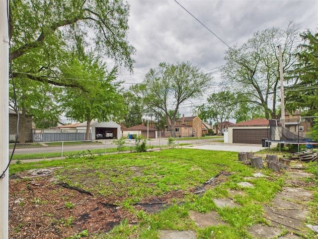 3356 W 84th St, Chicago, IL 60652 - view of yard with a trampoline, a garage, and an outdoor structure