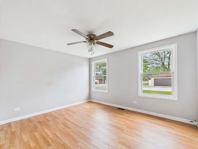 3356 W 84th St, Chicago, IL 60652 - unfurnished room featuring light wood finished floors, a ceiling fan, and baseboards