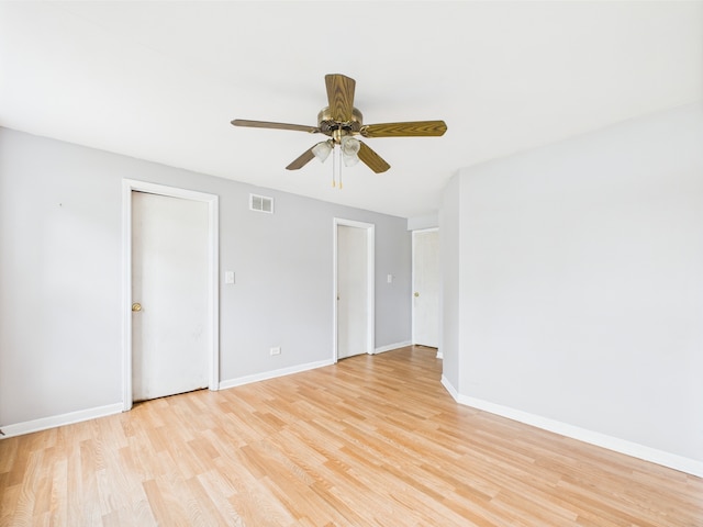 3356 W 84th St, Chicago, IL 60652 - spare room featuring light wood-style floors, baseboards, and a ceiling fan