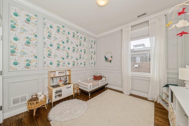 742 N Ada St Unit 3S, Chicago, IL 60642 - rec room with a decorative wall, crown molding, and dark wood-style flooring