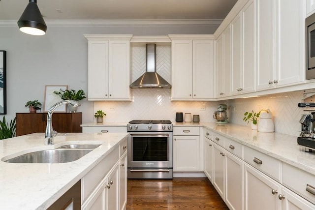 742 N Ada St Unit 3S, Chicago, IL 60642 - kitchen with appliances with stainless steel finishes, wall chimney range hood, a sink, white cabinetry, and decorative backsplash