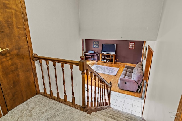 1103 Hillcrest Ave, Fox River Grove, IL 60021 - stairs featuring wood finished floors, a towering ceiling, and baseboards