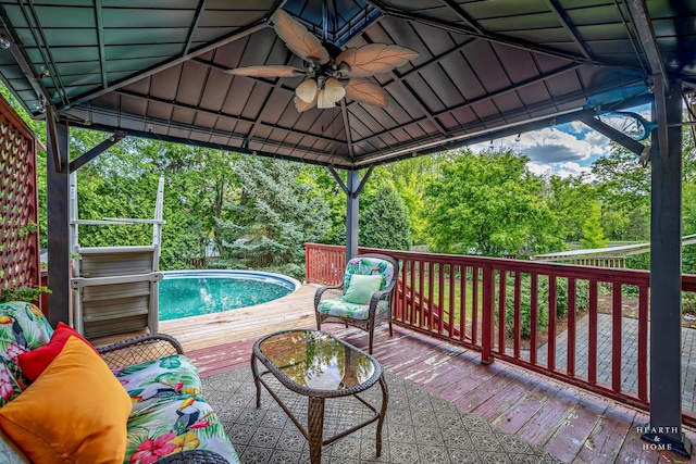 1103 Hillcrest Ave, Fox River Grove, IL 60021 - wooden deck with ceiling fan, a gazebo, an outdoor pool, and view of wooded area