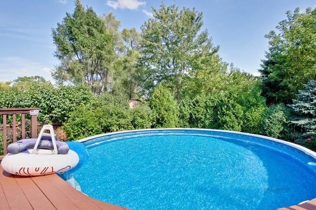 1103 Hillcrest Ave, Fox River Grove, IL 60021 - swimming pool featuring view of wooded area