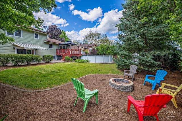 1103 Hillcrest Ave, Fox River Grove, IL 60021 - view of grassy yard with an outdoor fire pit, a gazebo, a deck, and an outdoor pool