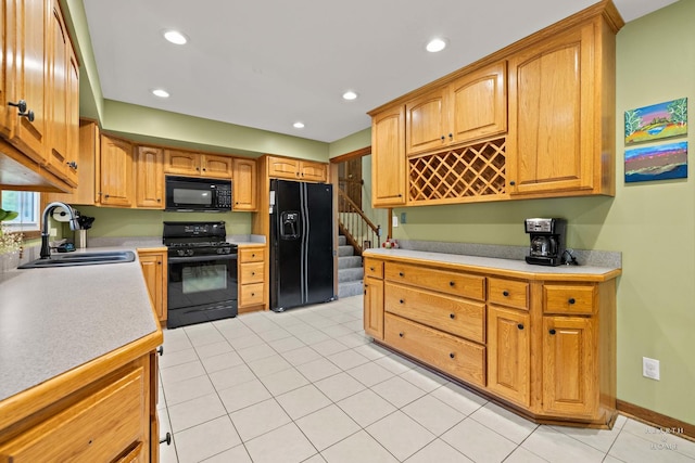 1103 Hillcrest Ave, Fox River Grove, IL 60021 - kitchen with black appliances, a sink, light countertops, recessed lighting, and light tile patterned floors