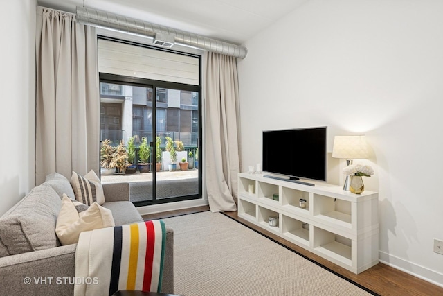 843 W Monroe St Unit 3B, Chicago, IL 60607 - living room featuring wood finished floors and baseboards