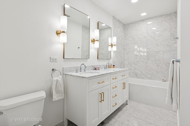 843 W Monroe St Unit 3B, Chicago, IL 60607 - bathroom with toilet, double vanity, recessed lighting, marble finish floors, and bathtub / shower combination