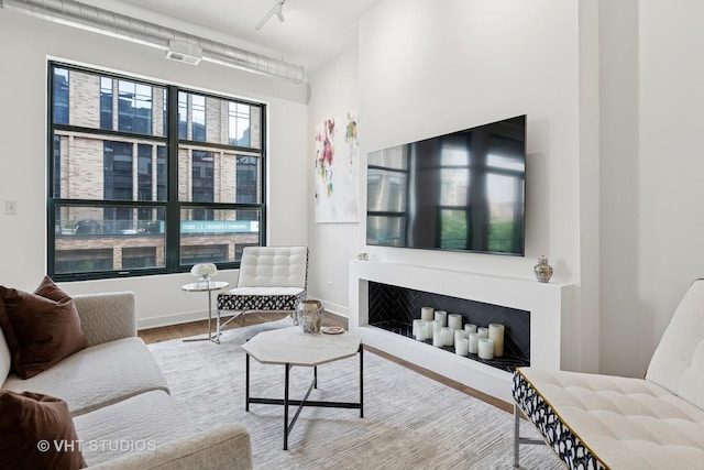 843 W Monroe St Unit 3B, Chicago, IL 60607 - living area with track lighting, wood finished floors, and baseboards