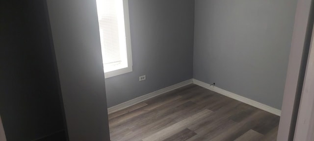10324 S Eberhart Ave, Chicago, IL 60628 - empty room featuring dark wood-style flooring and baseboards