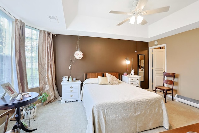 13538 Lehigh St, Huntley, IL 60142 - bedroom with light carpet, a ceiling fan, a raised ceiling, and a baseboard radiator