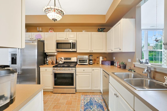 13538 Lehigh St, Huntley, IL 60142 - kitchen with stainless steel appliances, a sink, light countertops, and white cabinetry