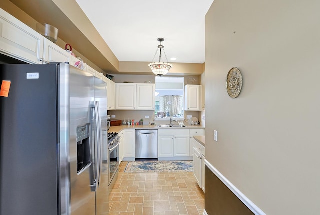 13538 Lehigh St, Huntley, IL 60142 - kitchen featuring appliances with stainless steel finishes, a sink, white cabinets, and light countertops